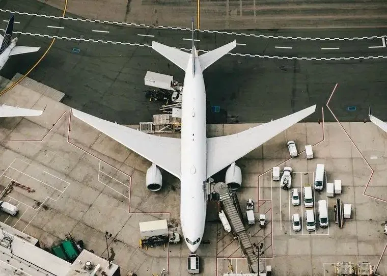 Commercial aircraft on apron, aerial view — illustrating the recovery cycle