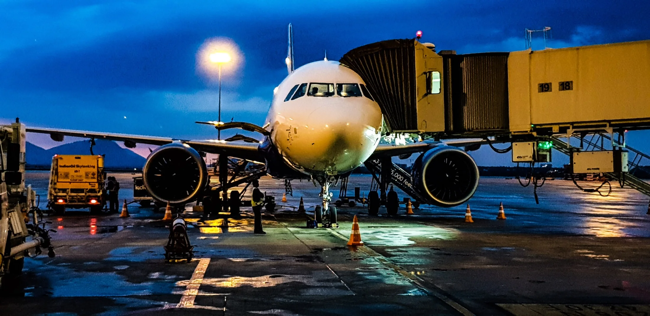 Commercial aircraft at dusk, during ground operations and maintenance